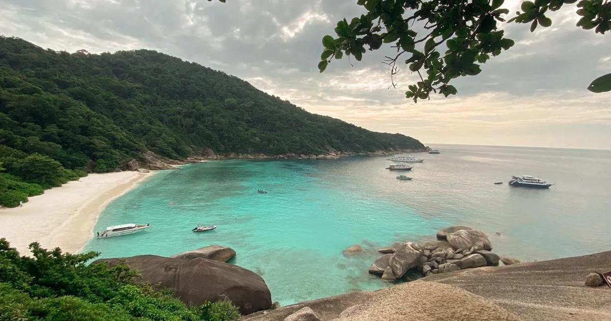 Dive boats moored in a sheltered tropical bay