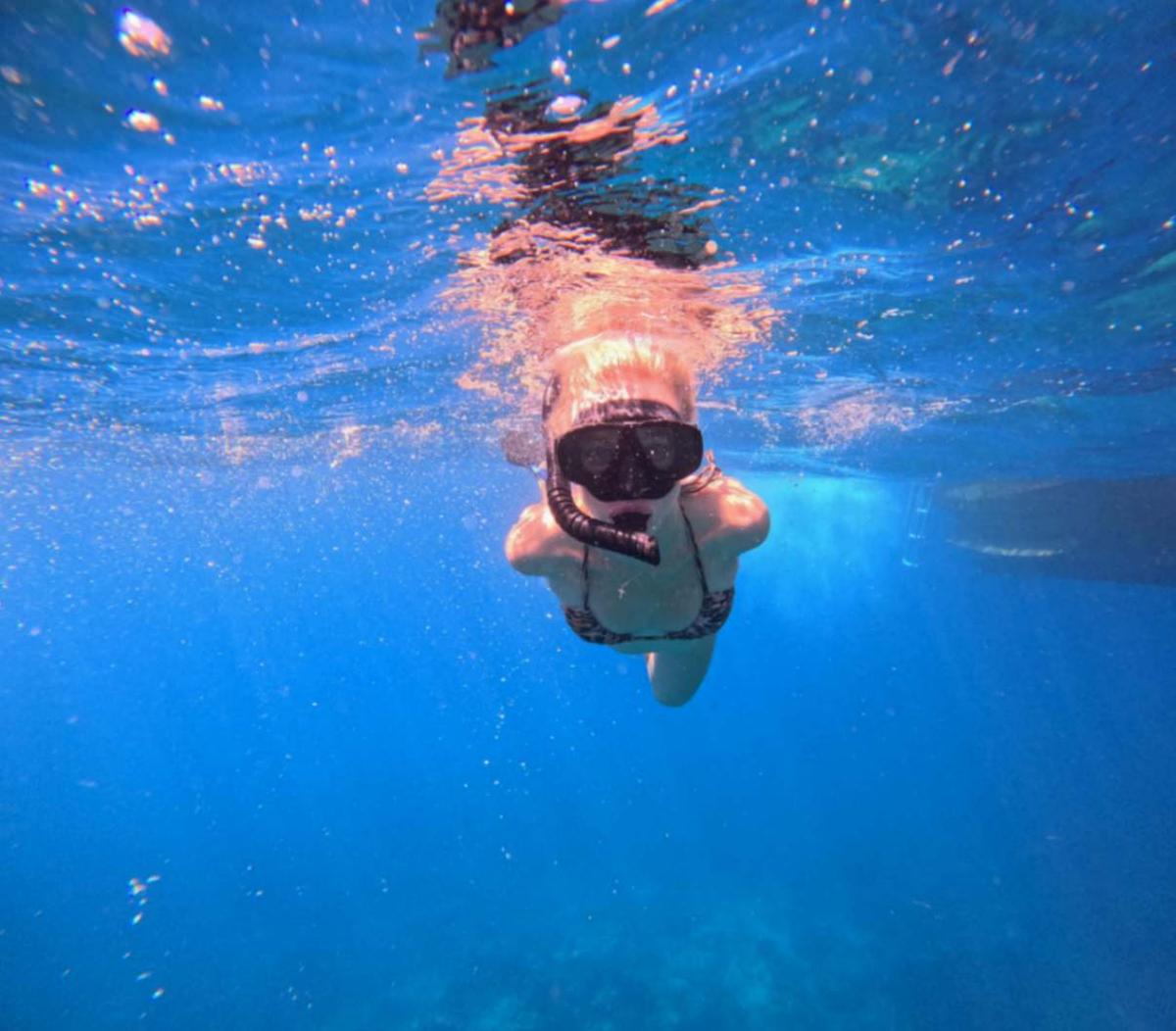 Snorkeler in blue water off Koh Chang, Thailand